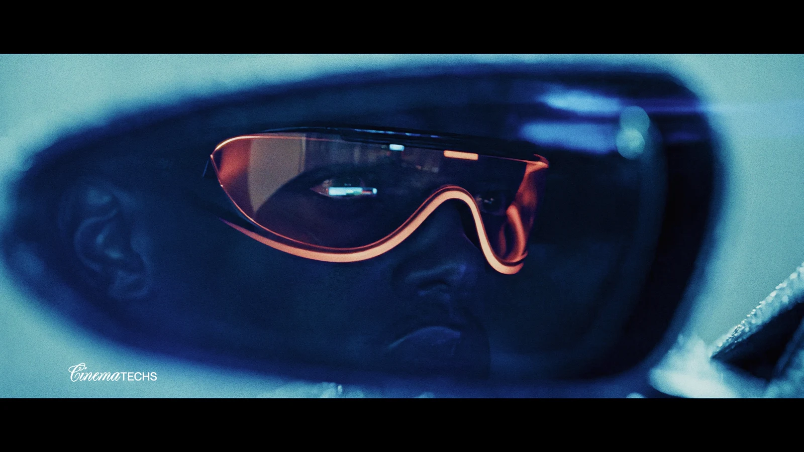 Chrome concept — driver detail, amber goggles against the cool blue interior.