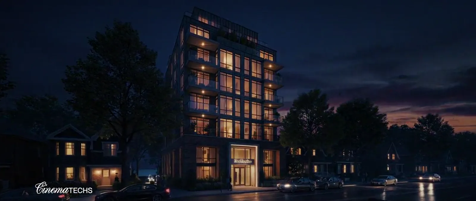 The Shoreline at night — warm-lit windows and balconies against a dark sky, from the launch film.